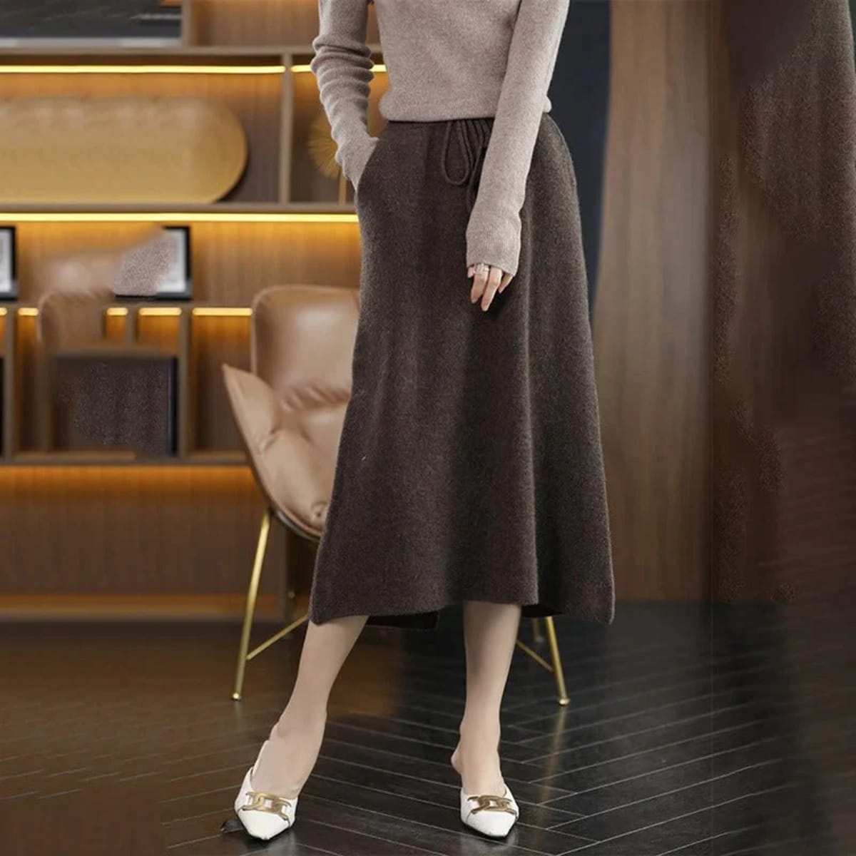 Knit midi skirt with drawstring waist and straight silhouette.