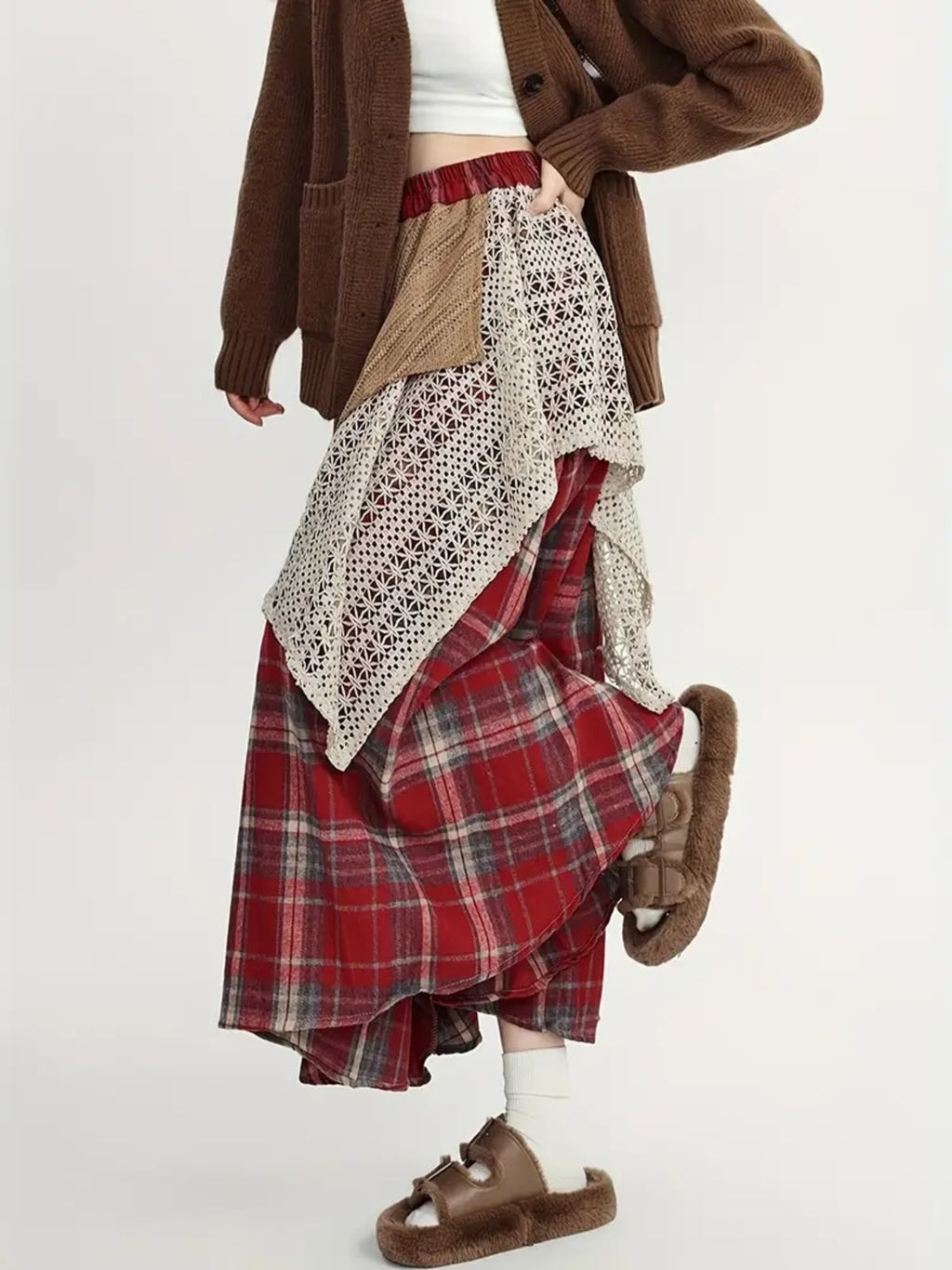 Person wearing asymmetric layered maxi skirt with patchwork design