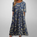Relaxed floral midi dress with flowing silhouette and lightweight fabric.