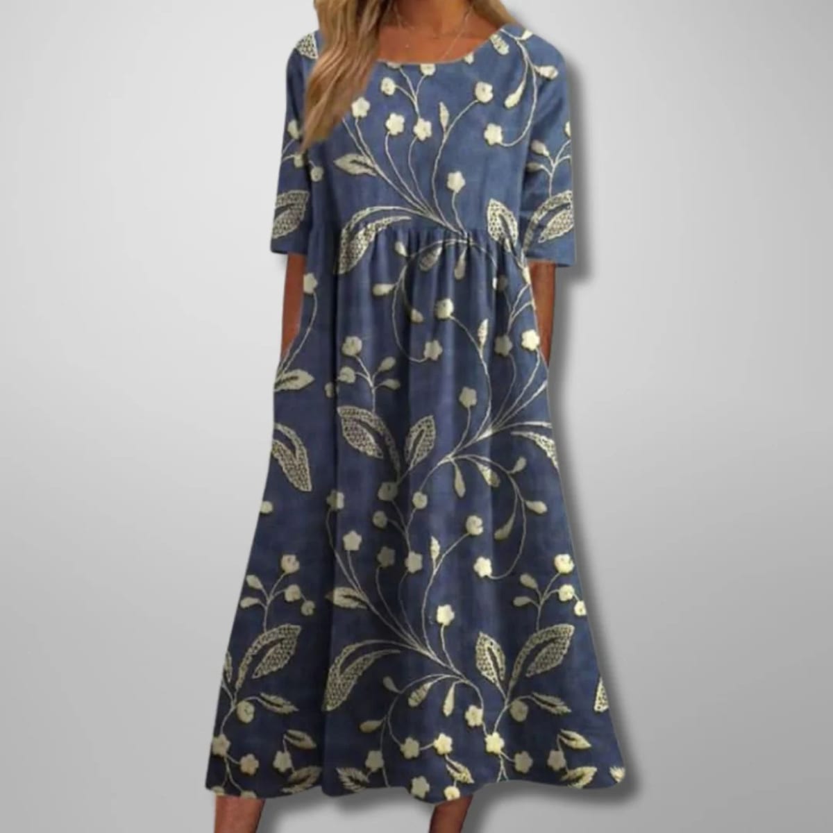 Relaxed floral midi dress with flowing silhouette and lightweight fabric.
