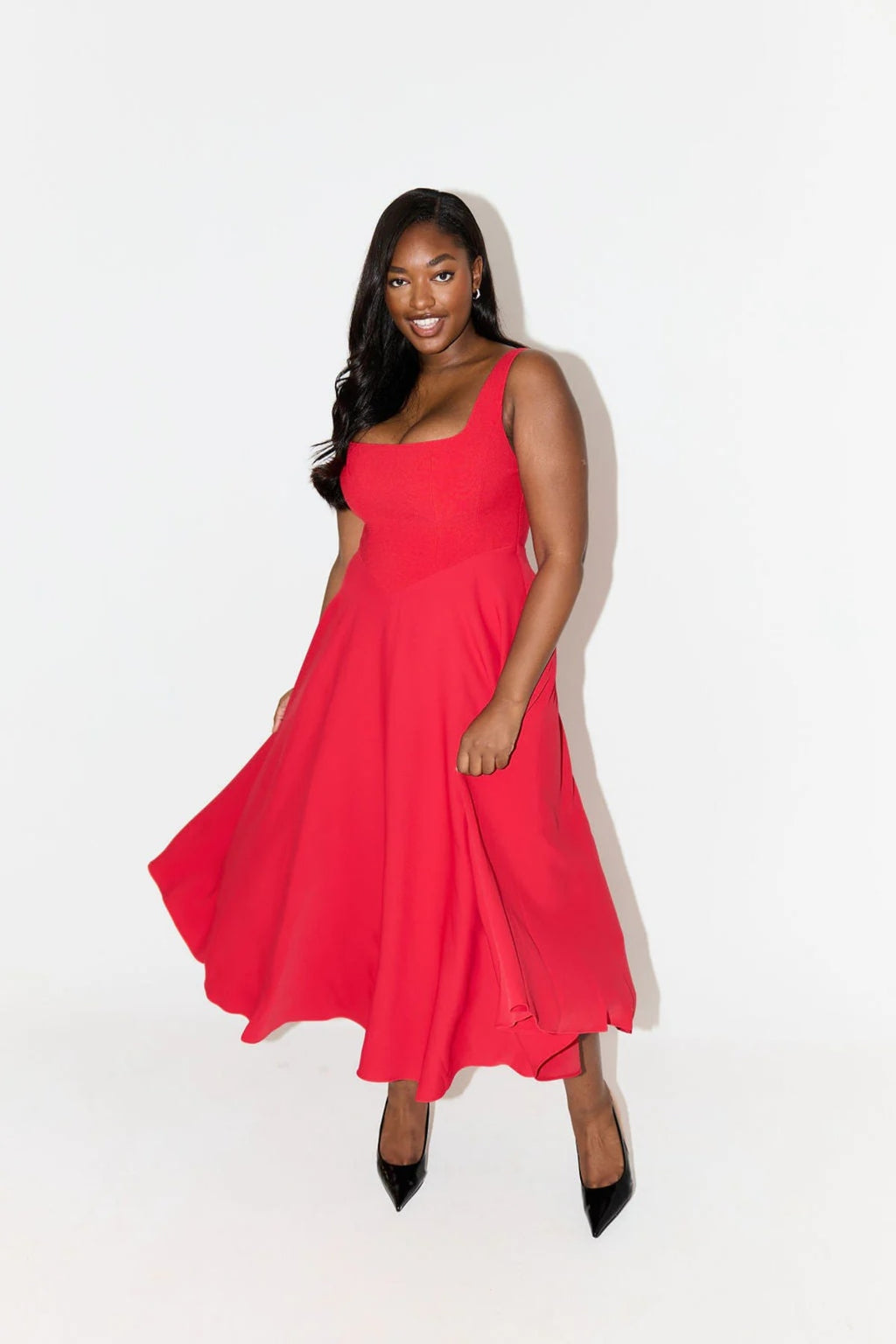 Square neck midi dress with waist-defining fit and flowing skirt.