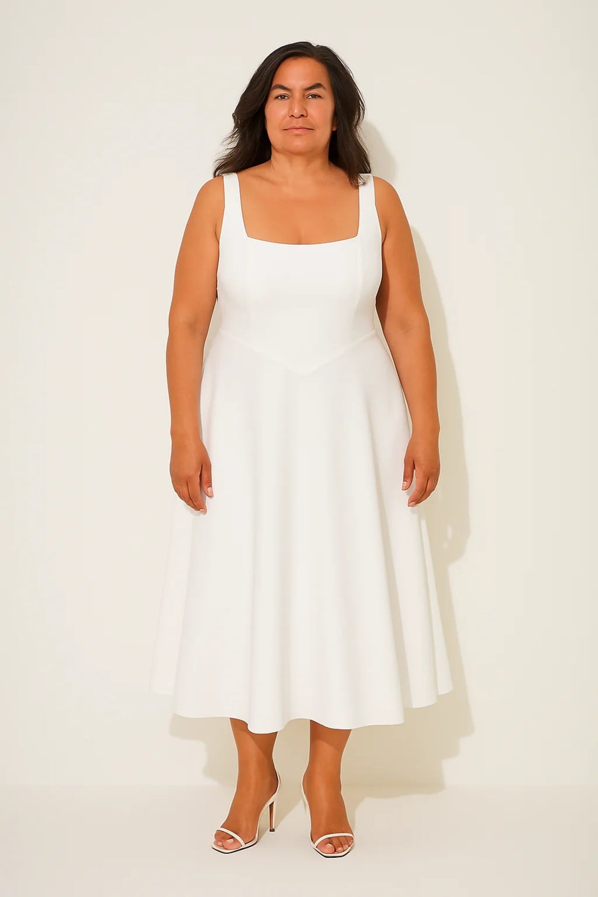 Square neck midi dress with waist-defining fit and flowing skirt.