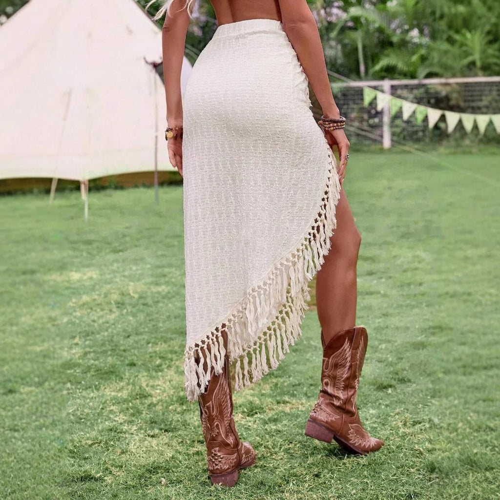 Cream midi skirt with fringe trim and high slit.