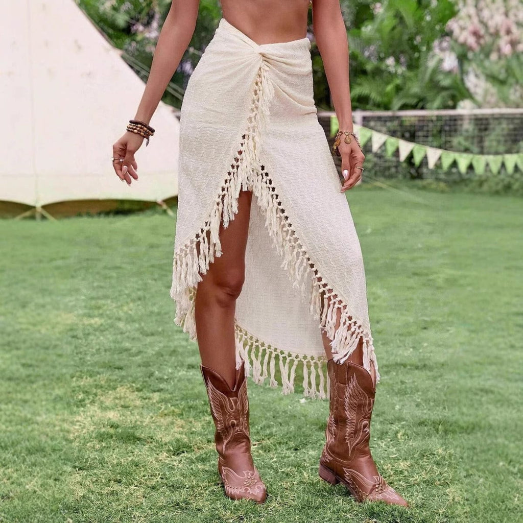 Cream midi skirt with fringe trim and high slit.