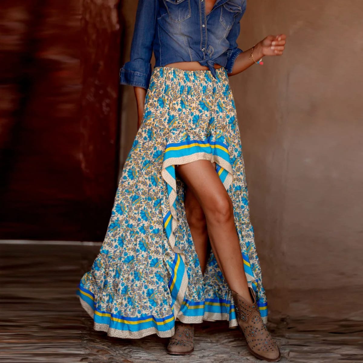 Woman wearing floral high-low maxi skirt with crochet top and sandals