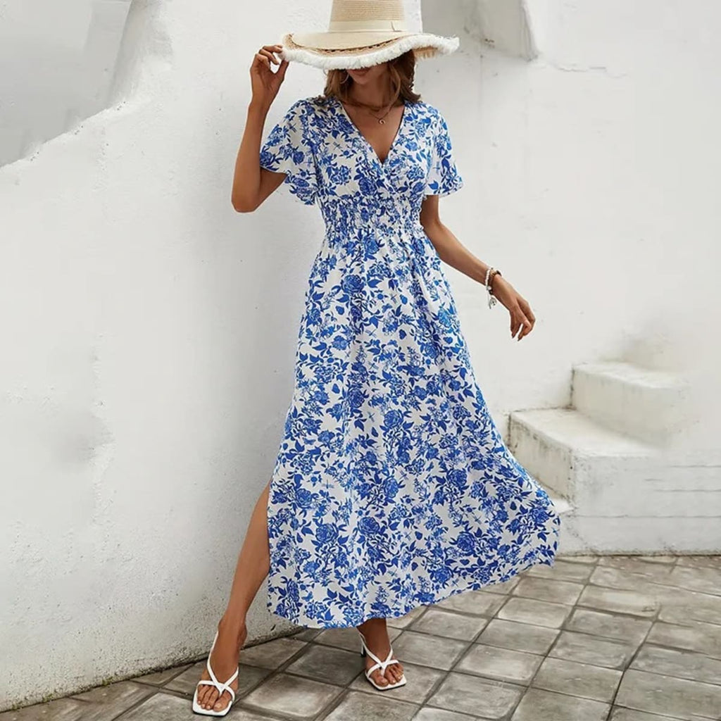 Flowy beach dress with V-neckline and subtle pattern.