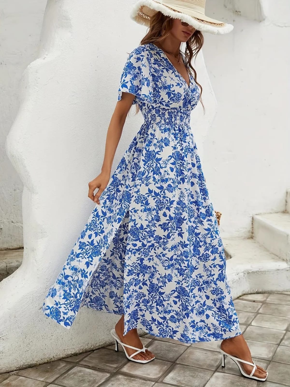 Flowy beach dress with V-neckline and subtle pattern.