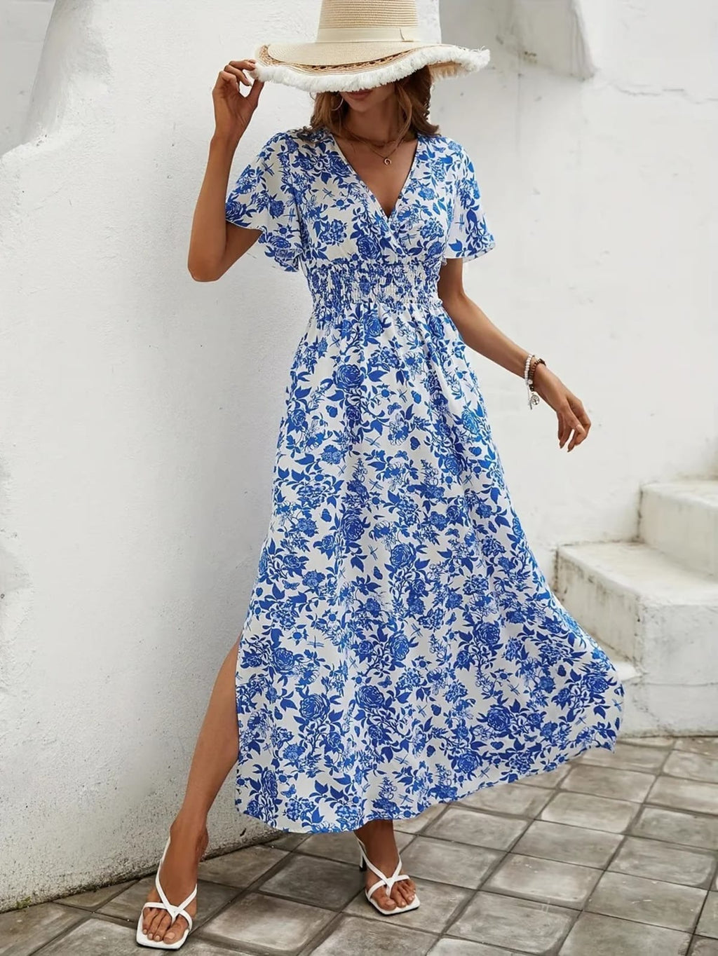 Flowy beach dress with V-neckline and subtle pattern.