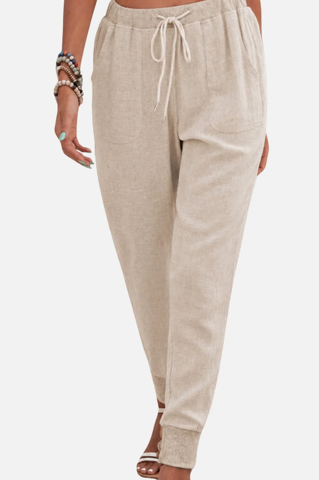 Women's drawstring joggers with elastic ankle cuffs and side pockets.