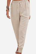 Women's drawstring joggers with elastic ankle cuffs and side pockets.