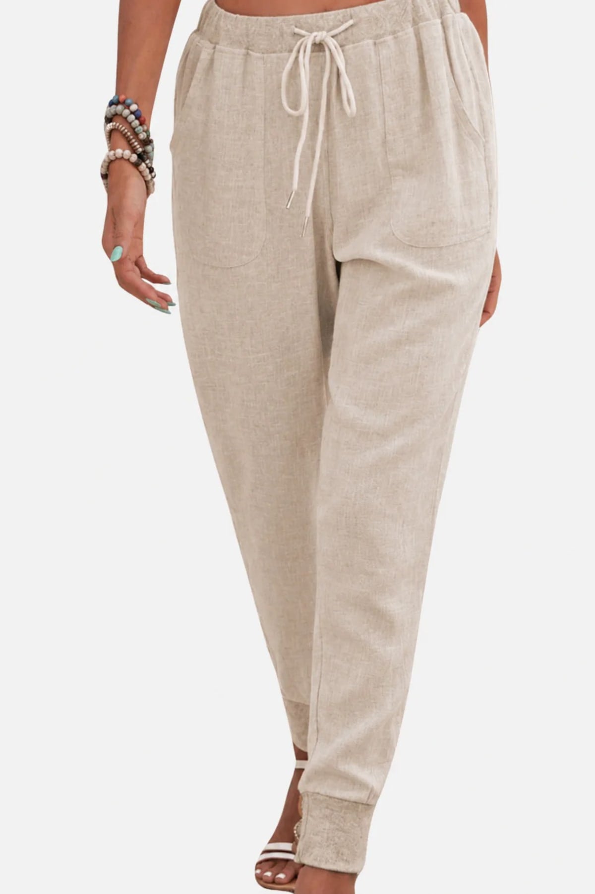 Women's drawstring joggers with elastic ankle cuffs and side pockets.