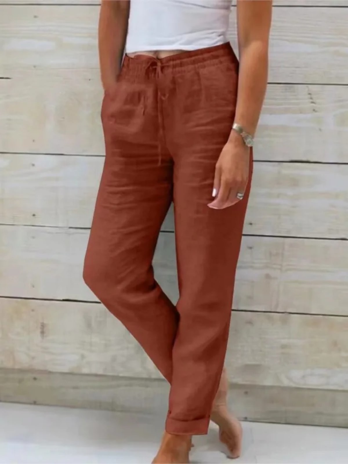 Women's drawstring joggers with elastic ankle cuffs and side pockets.
