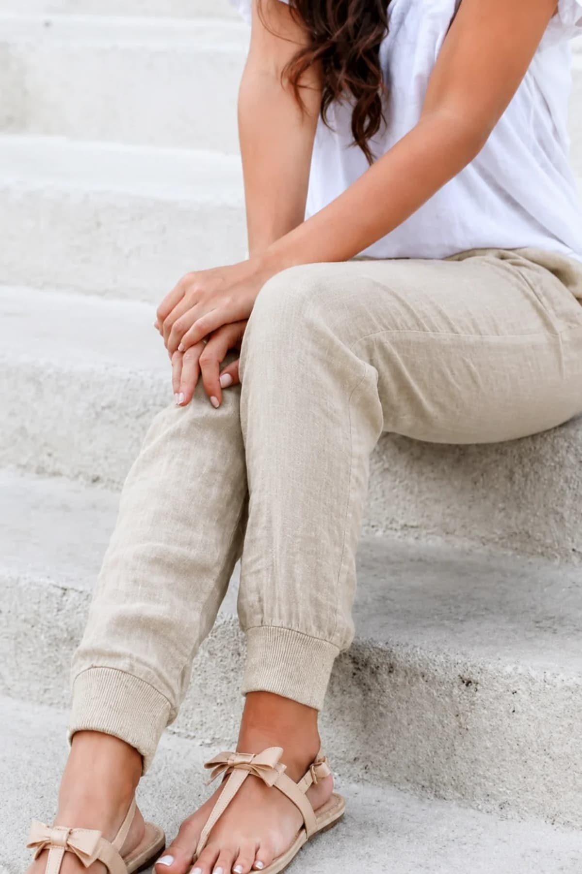 Women's drawstring joggers with elastic ankle cuffs and side pockets.