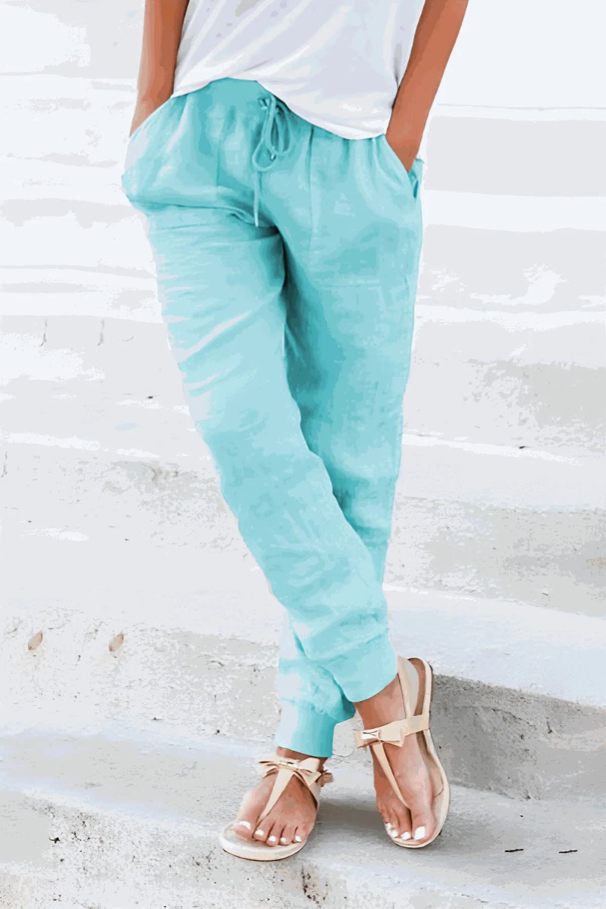 Women's drawstring joggers with elastic ankle cuffs and side pockets.