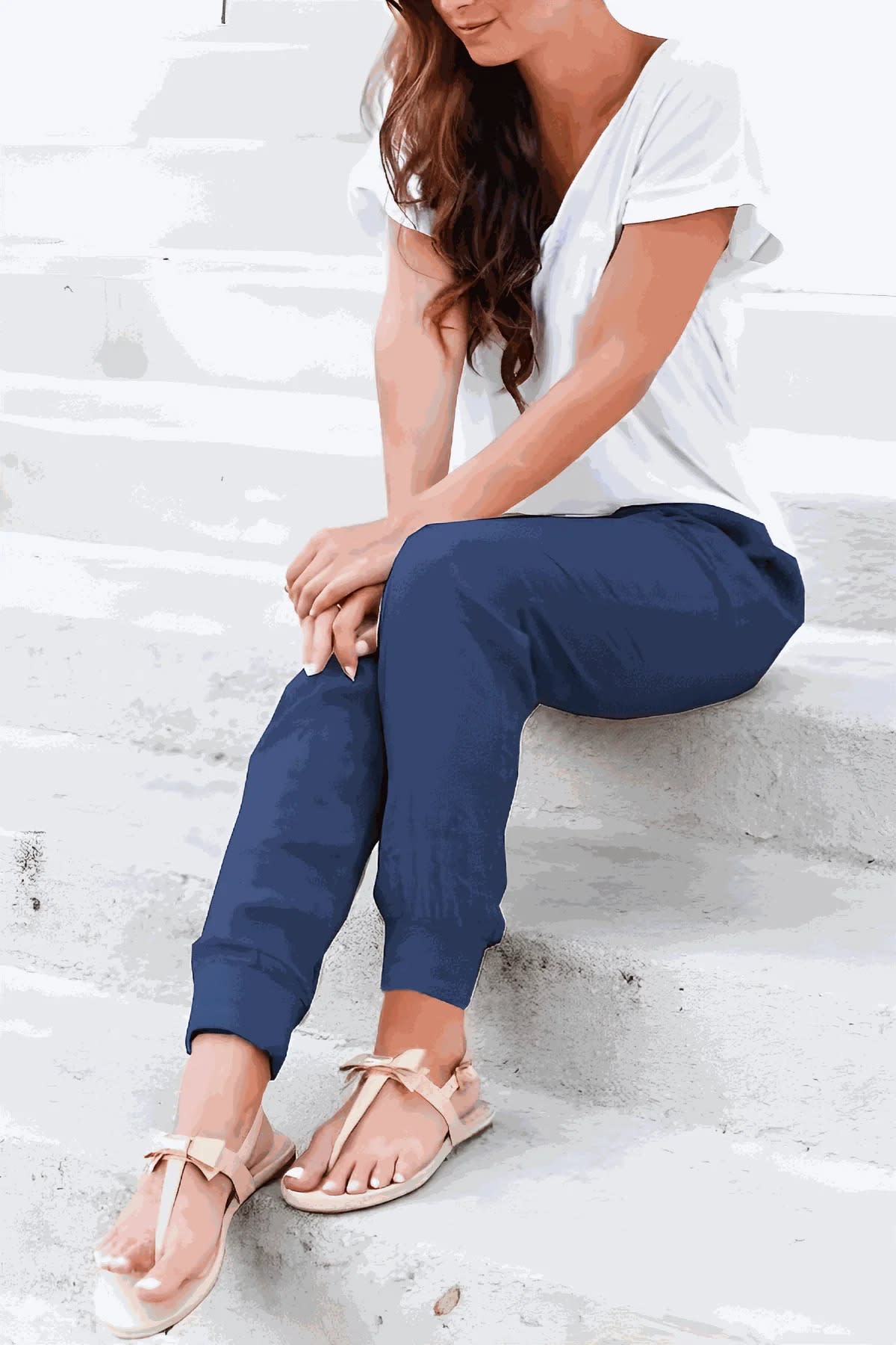 Women's drawstring joggers with elastic ankle cuffs and side pockets.