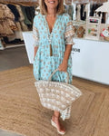 Boho midi dress with tassels and a flowing silhouette.