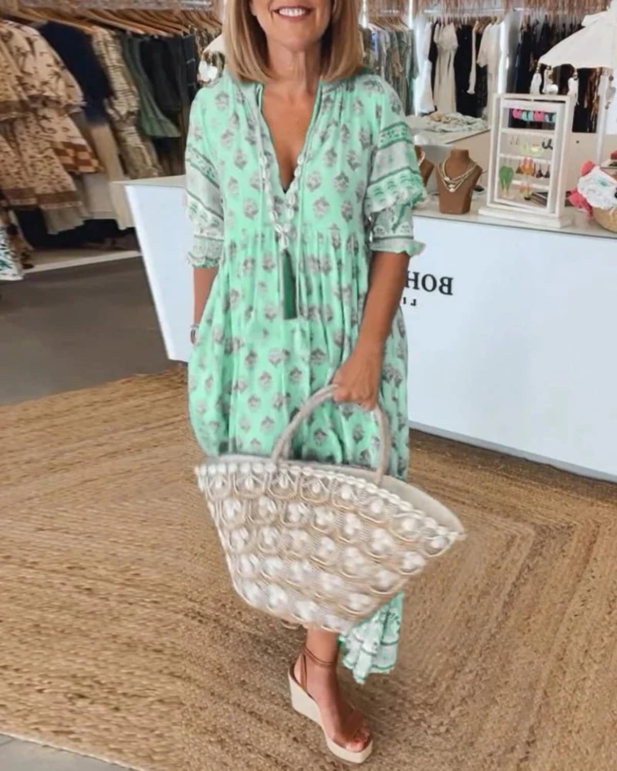 Boho midi dress with tassels and a flowing silhouette.