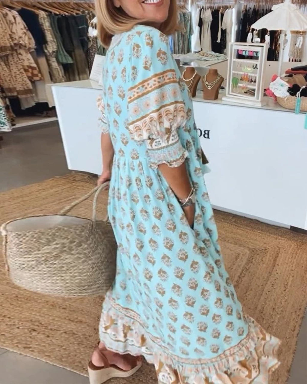 Boho midi dress with tassels and a flowing silhouette.