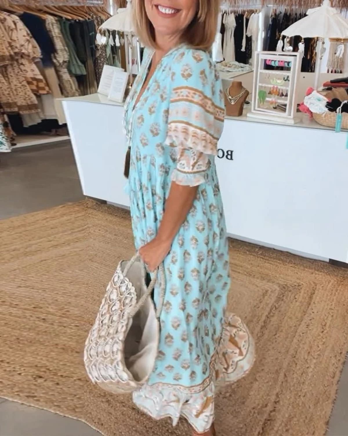 Boho midi dress with tassels and a flowing silhouette.