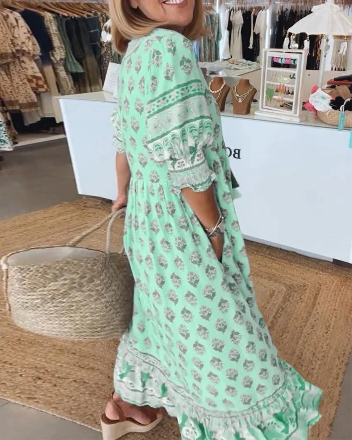Boho midi dress with tassels and a flowing silhouette.