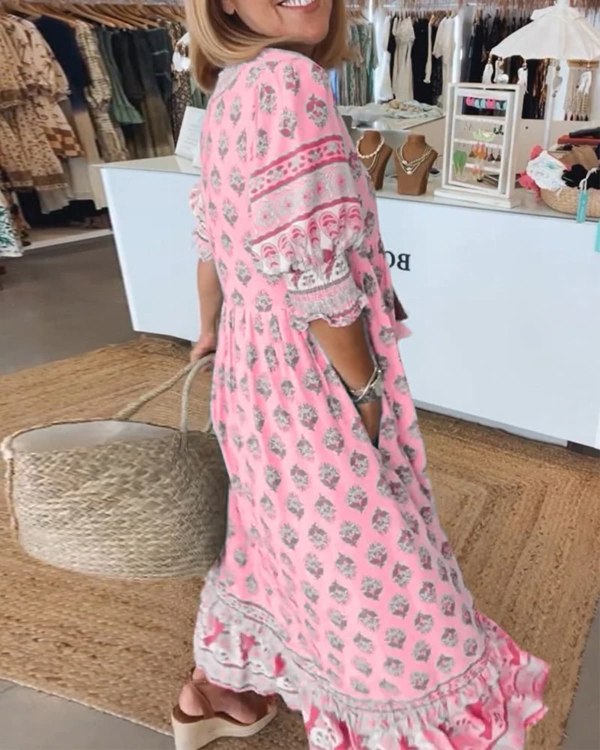 Boho midi dress with tassels and a flowing silhouette.