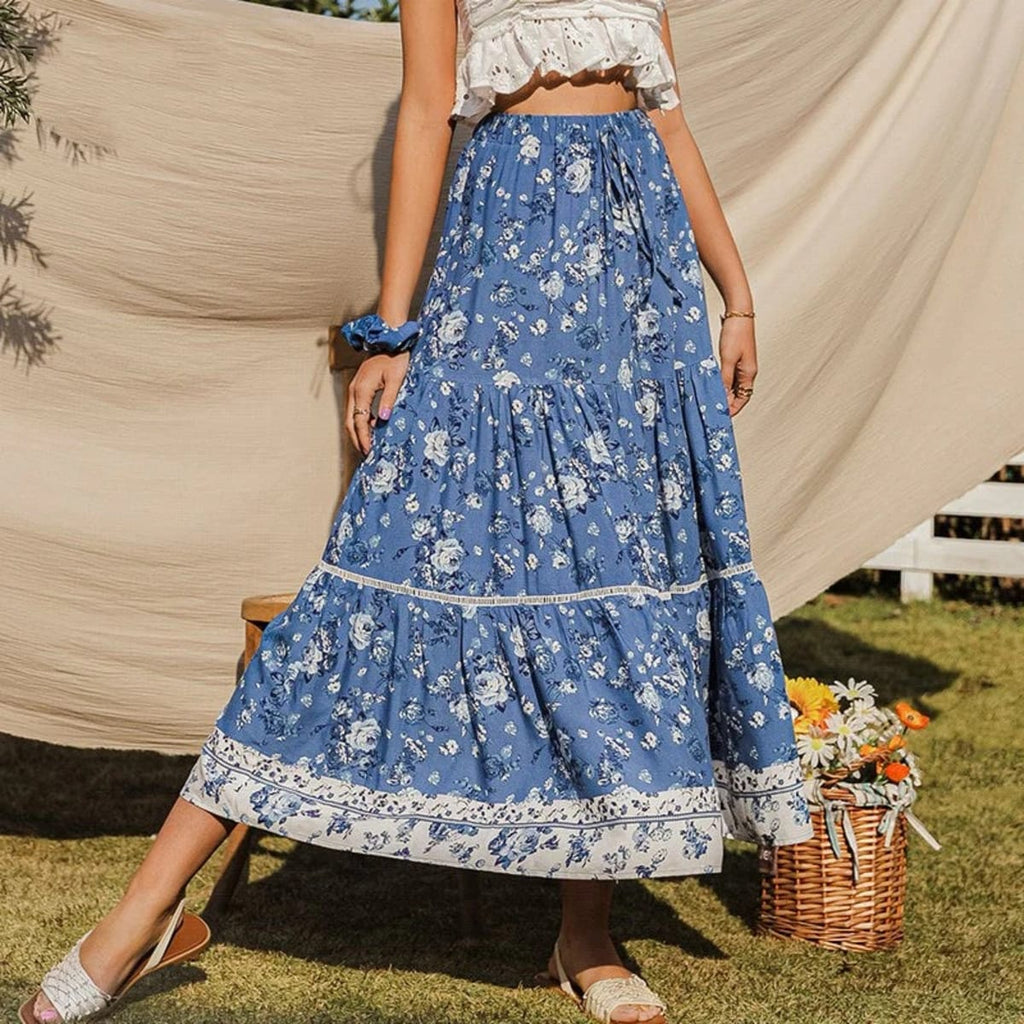 Woman wearing floral tiered maxi skirt with patterned hem outdoors