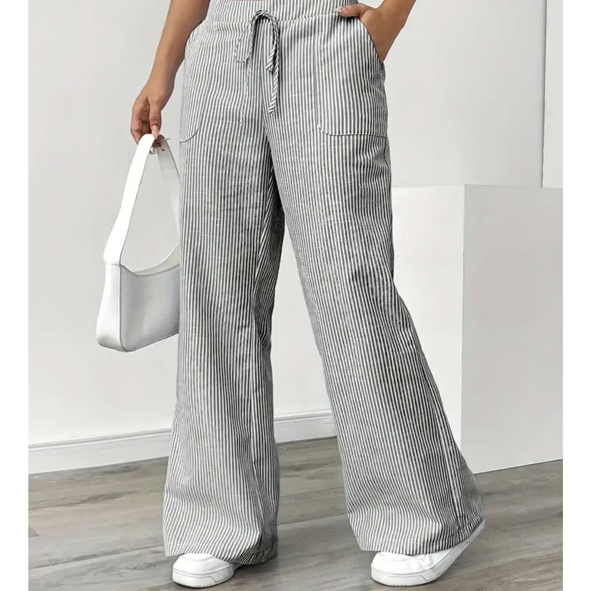 Striped pants with adjustable waistband and pockets for women.