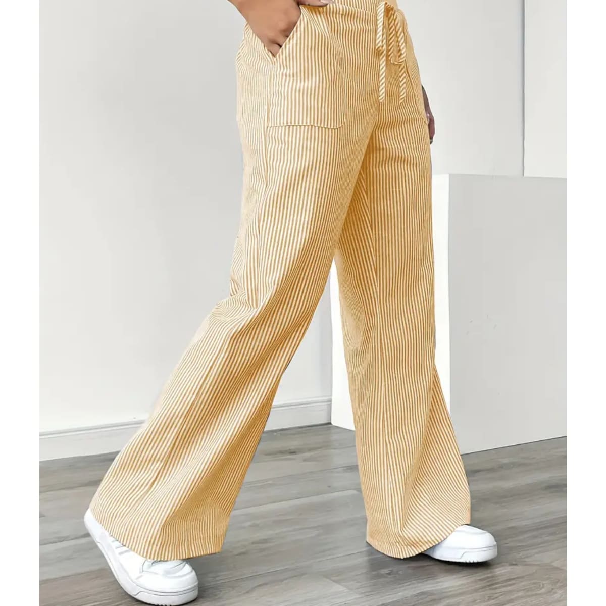 Striped pants with adjustable waistband and pockets for women.
