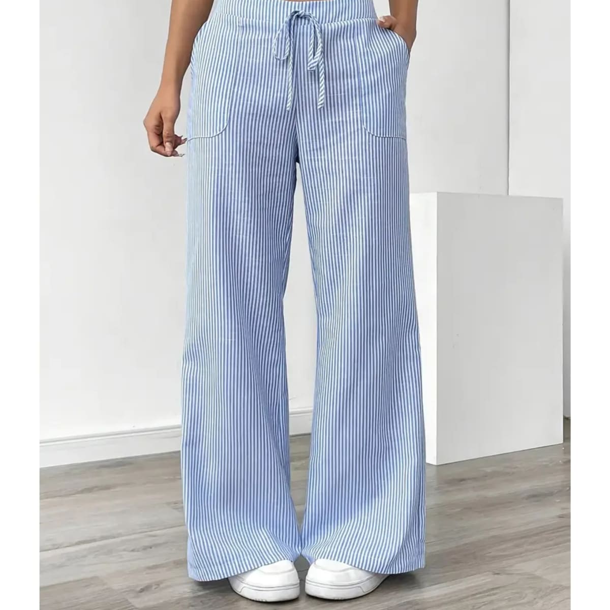 Striped pants with adjustable waistband and pockets for women.