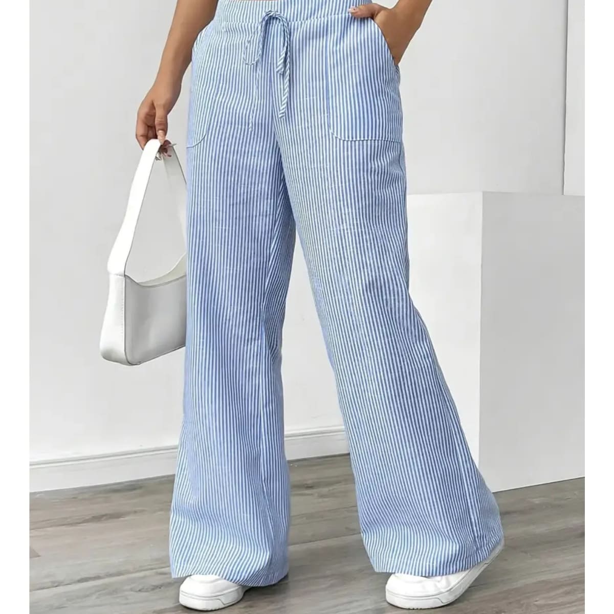 Striped pants with adjustable waistband and pockets for women.