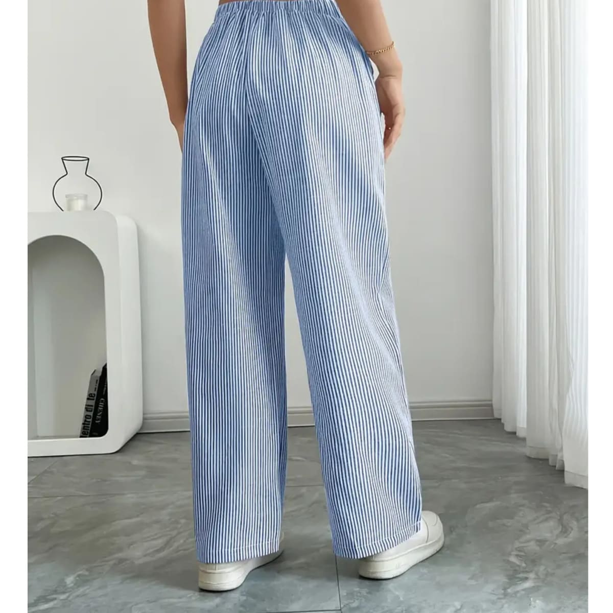 Striped pants with adjustable waistband and pockets for women.