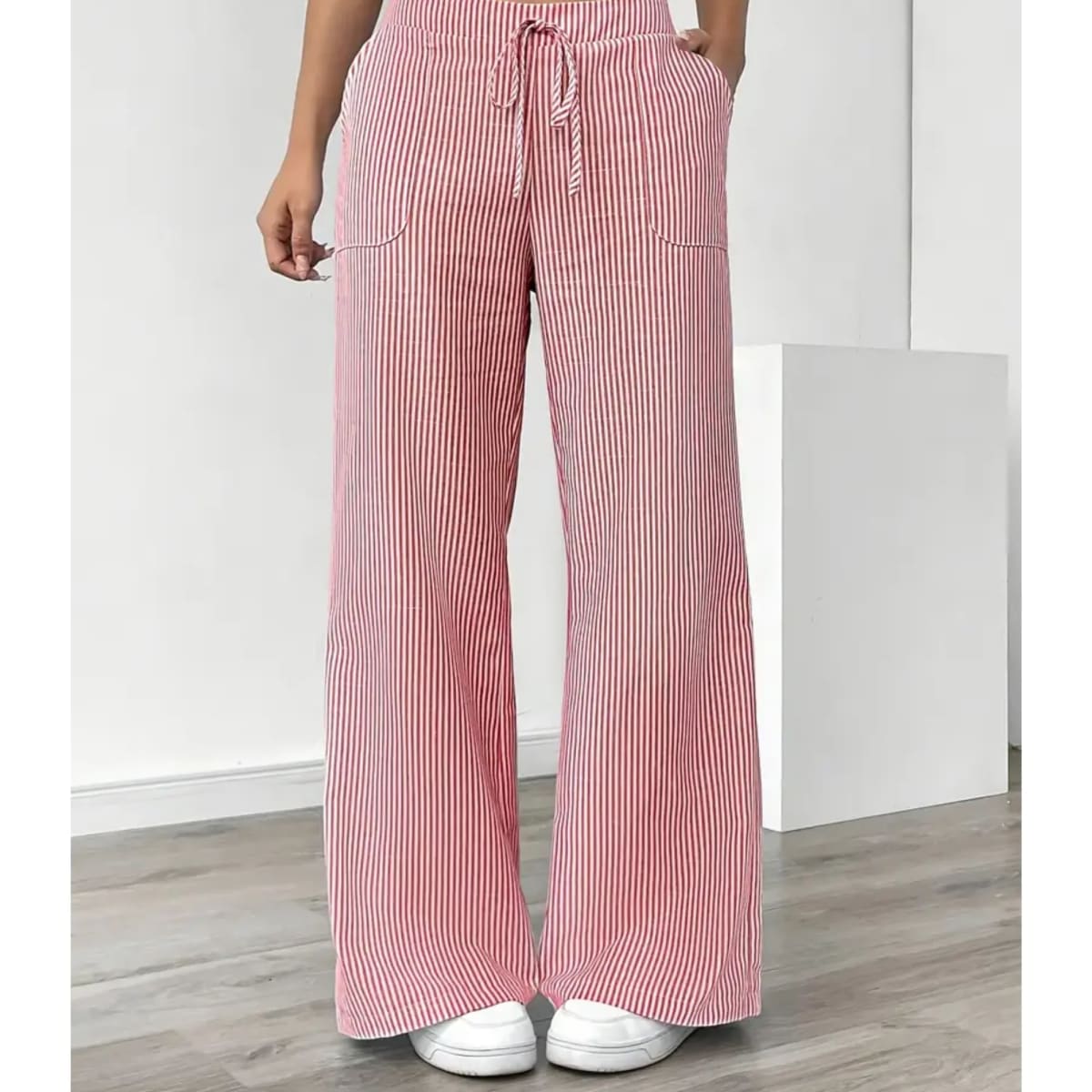 Striped pants with adjustable waistband and pockets for women.
