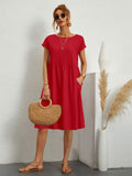 Casual dress with side pockets, relaxed fit.