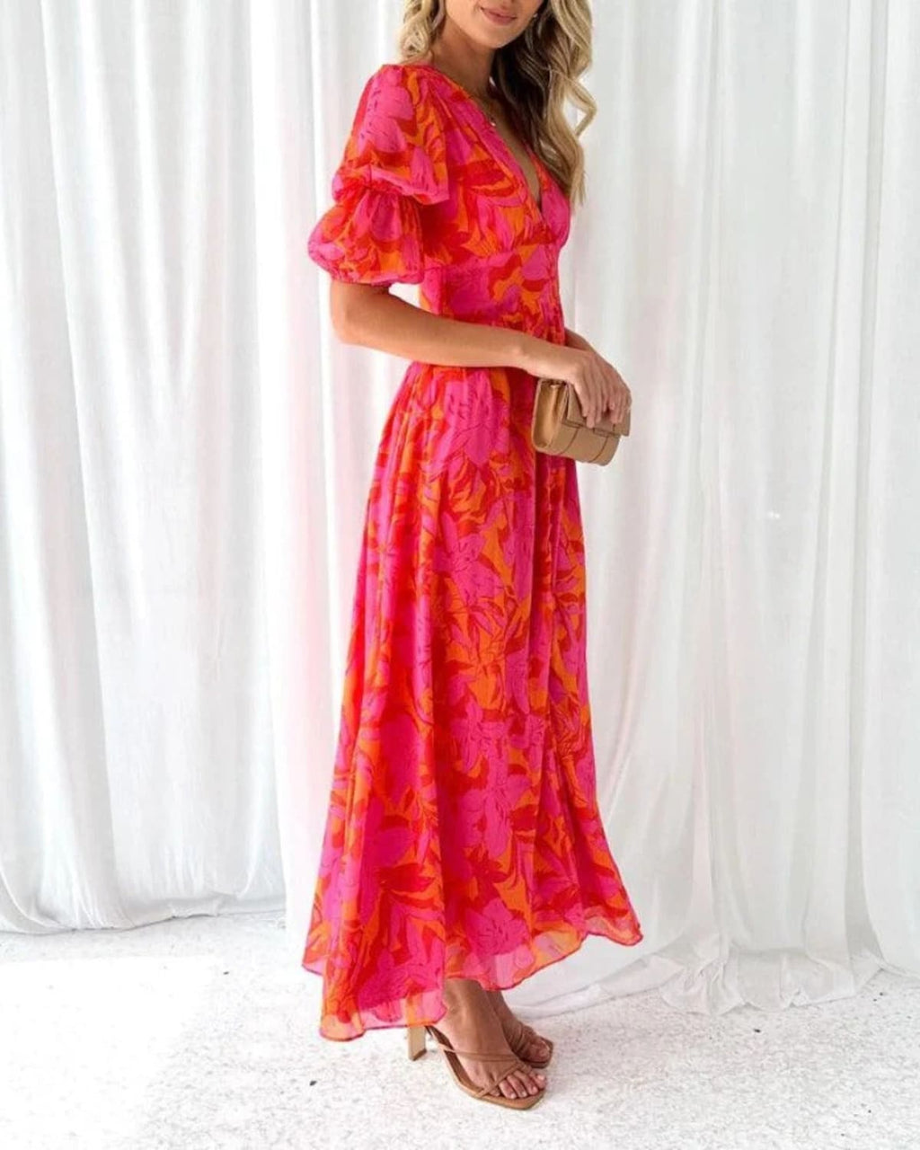 Maxi dress with puff sleeves and flowing silhouette, perfect for events.