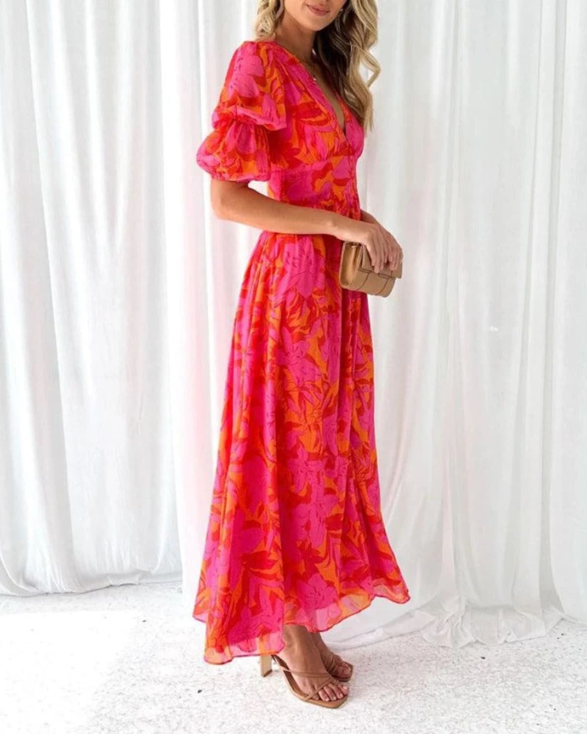 Maxi dress with puff sleeves and flowing silhouette, perfect for events.