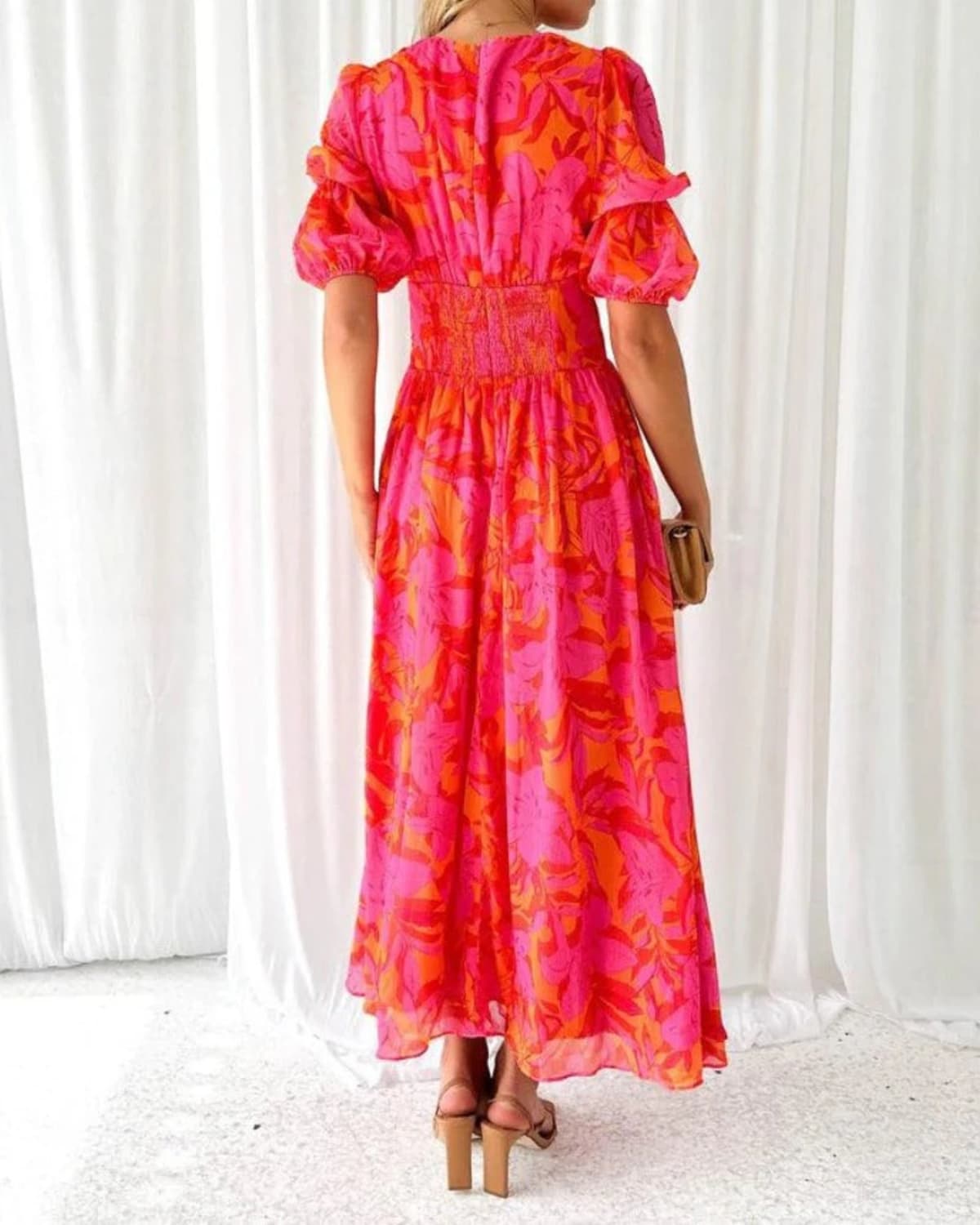 Maxi dress with puff sleeves and flowing silhouette, perfect for events.