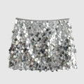 Silver sequin mini skirt with a fringe-like effect on a grey background