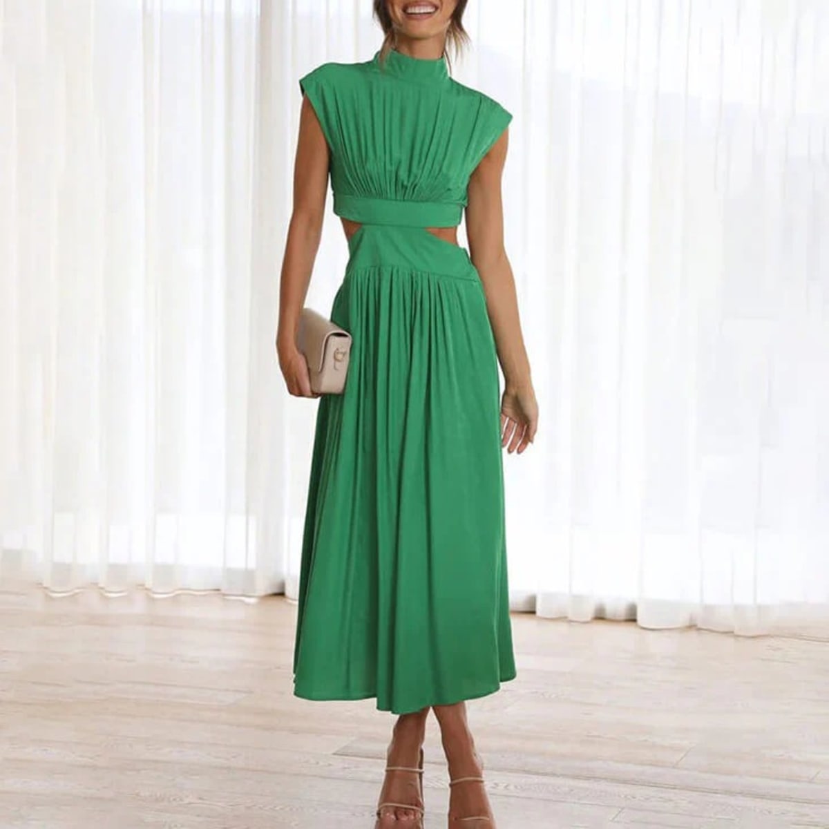 Woman wearing a halter neck flowing dress outdoors.