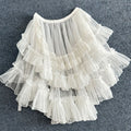 White layered ruffled skirt overlay with sheer tulle and lace.