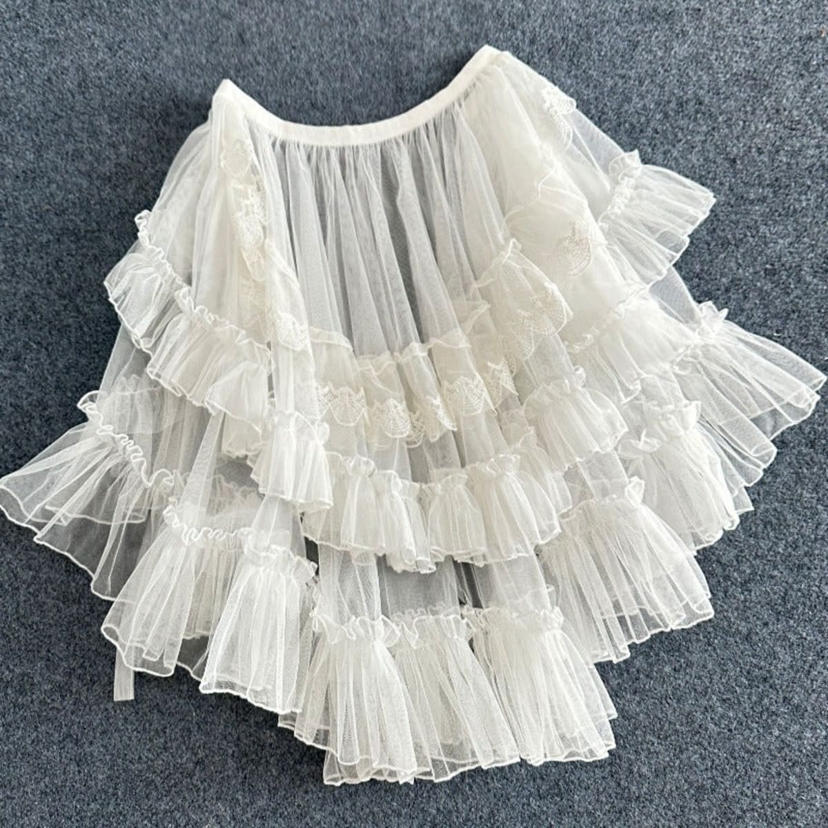 White layered ruffled skirt overlay with sheer tulle and lace.