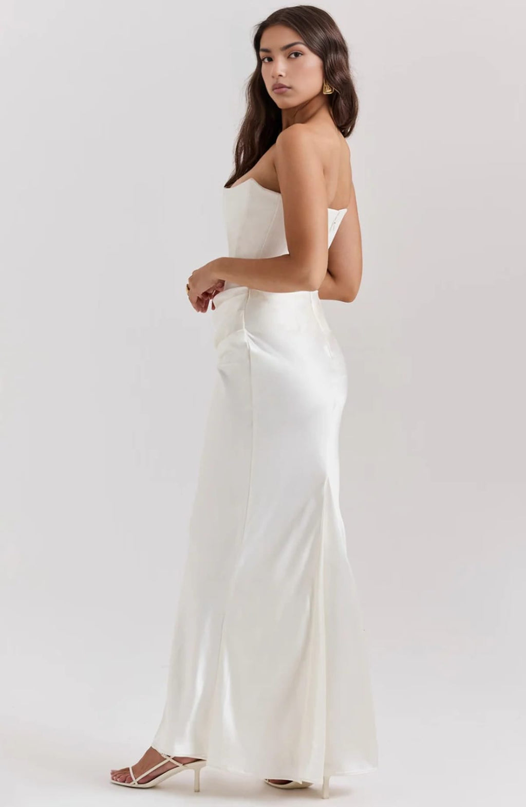 Strapless lace evening dress with flowing skirt, structured bodice.