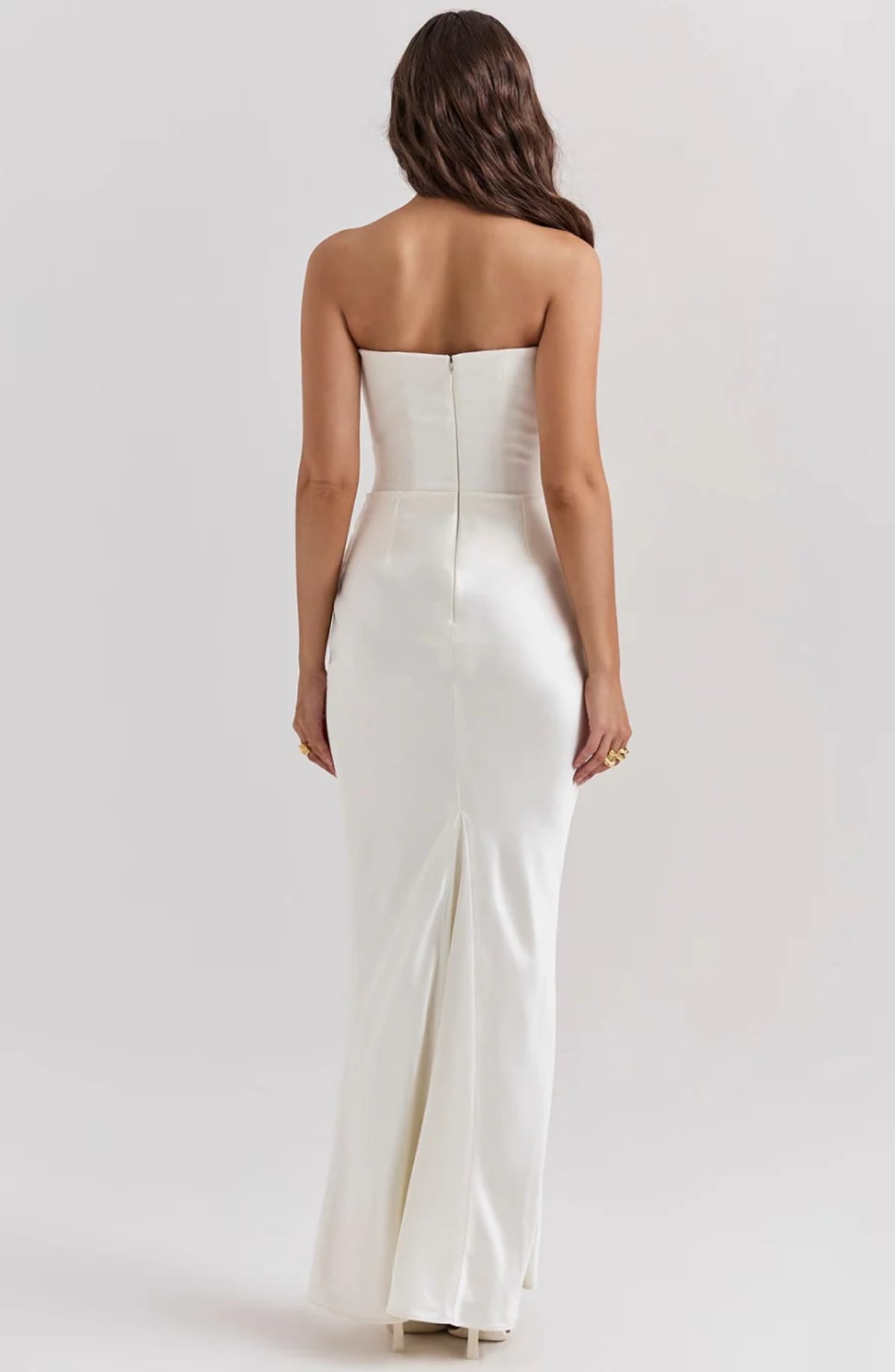 Strapless lace evening dress with flowing skirt, structured bodice.