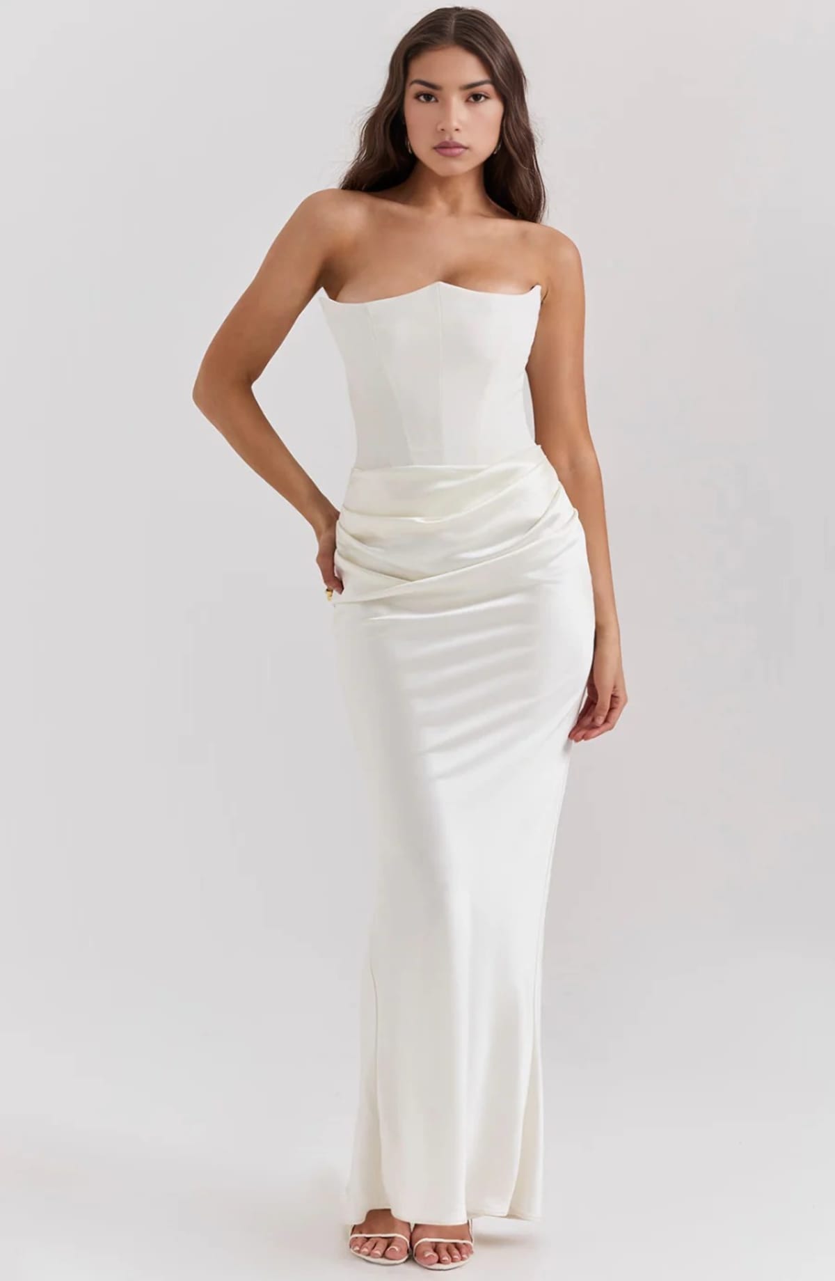 Strapless lace evening dress with flowing skirt, structured bodice.