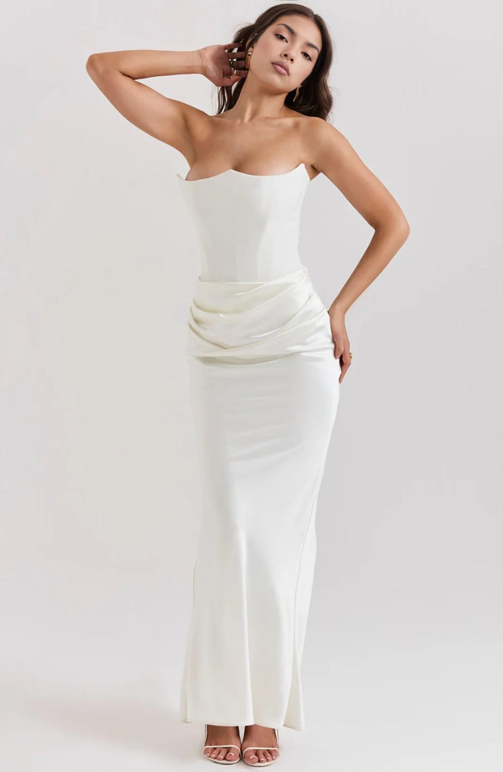 Strapless lace evening dress with flowing skirt, structured bodice.