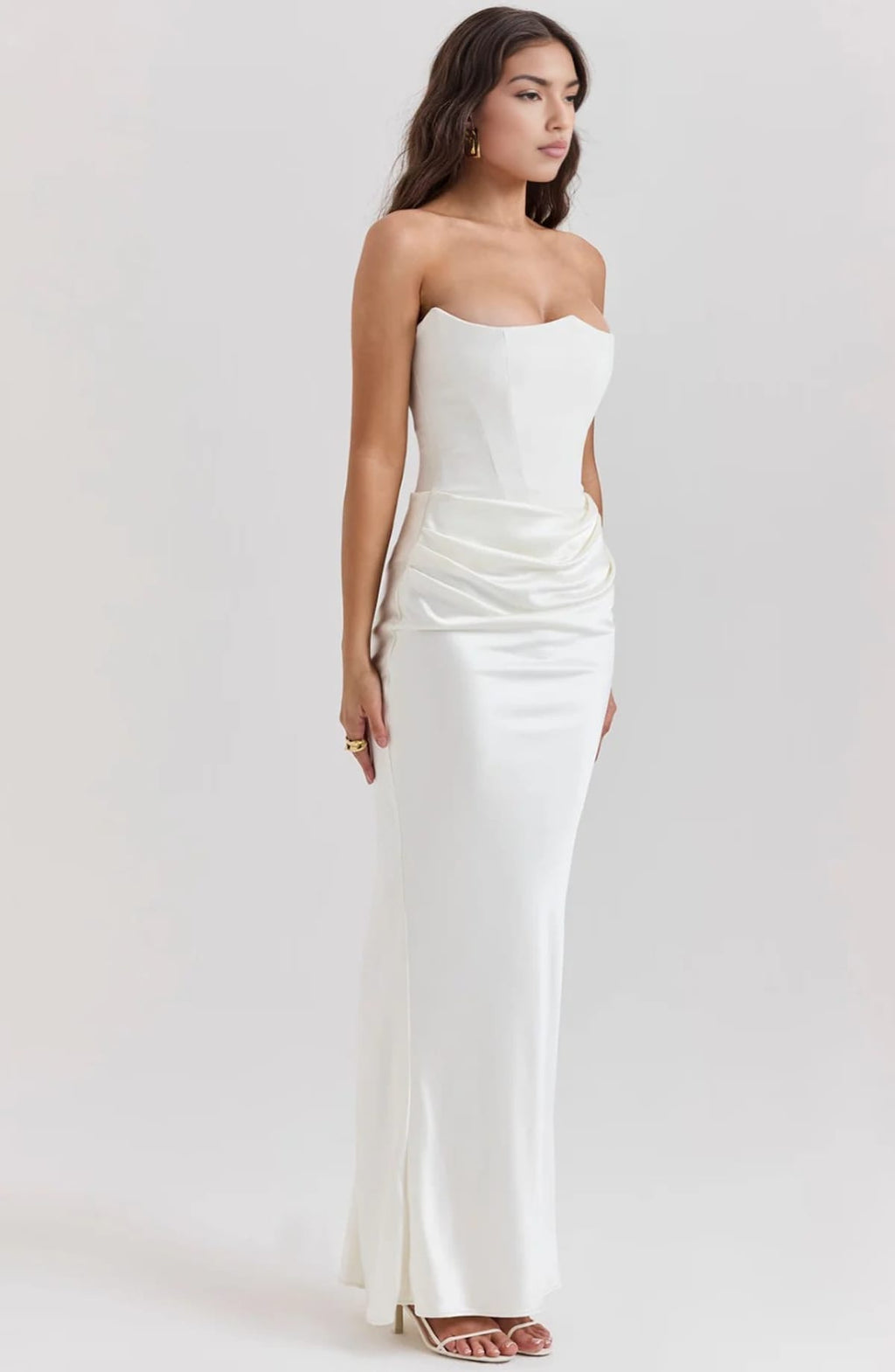 Strapless lace evening dress with flowing skirt, structured bodice.