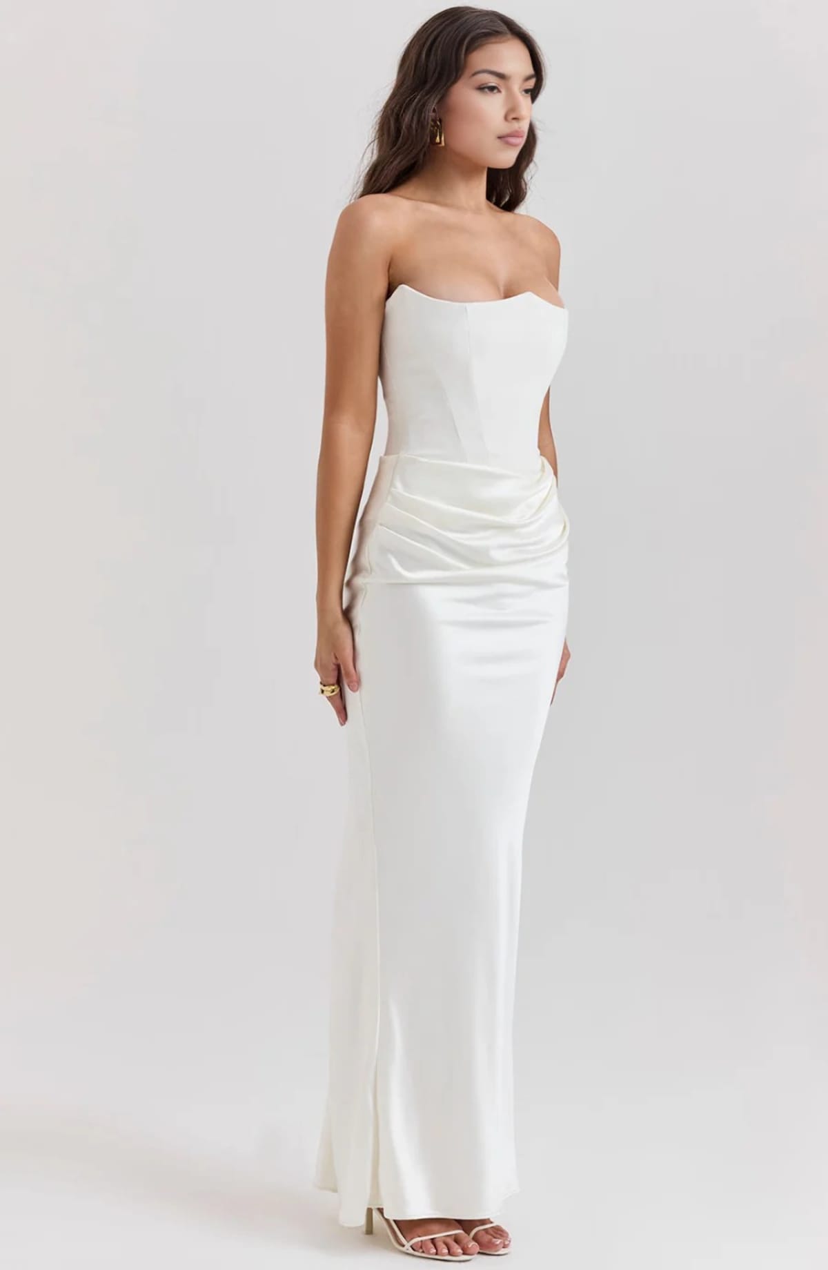 Strapless lace evening dress with flowing skirt, structured bodice.
