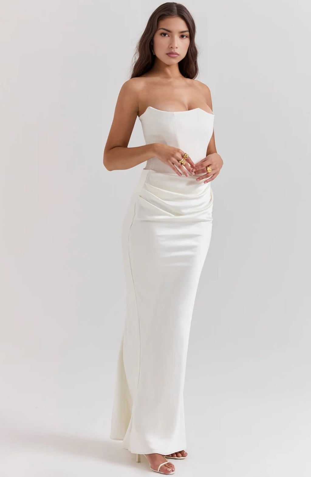 Strapless lace evening dress with flowing skirt, structured bodice.