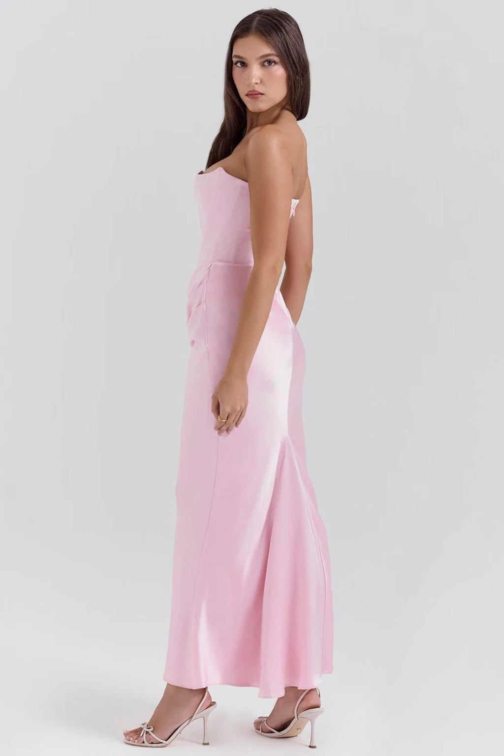 Strapless lace evening dress with flowing skirt, structured bodice.