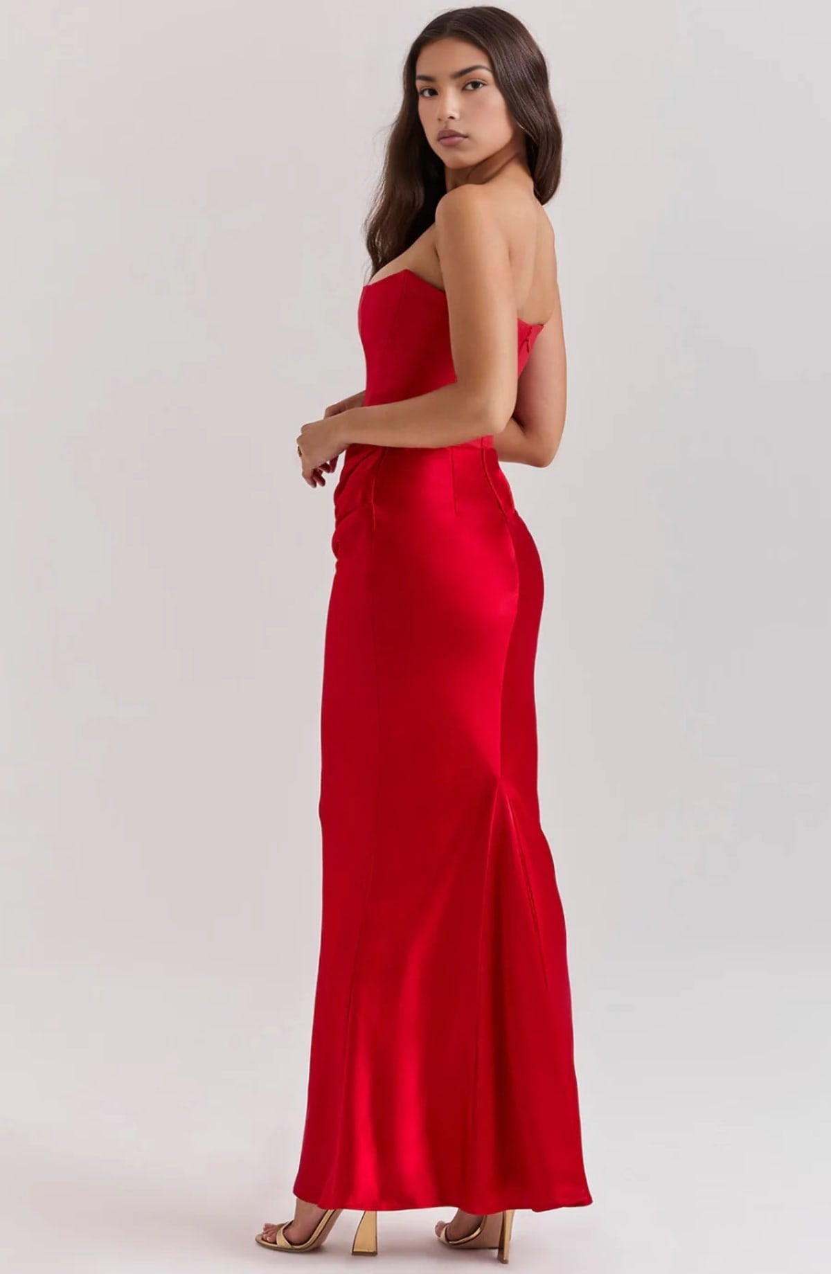 Strapless lace evening dress with flowing skirt, structured bodice.