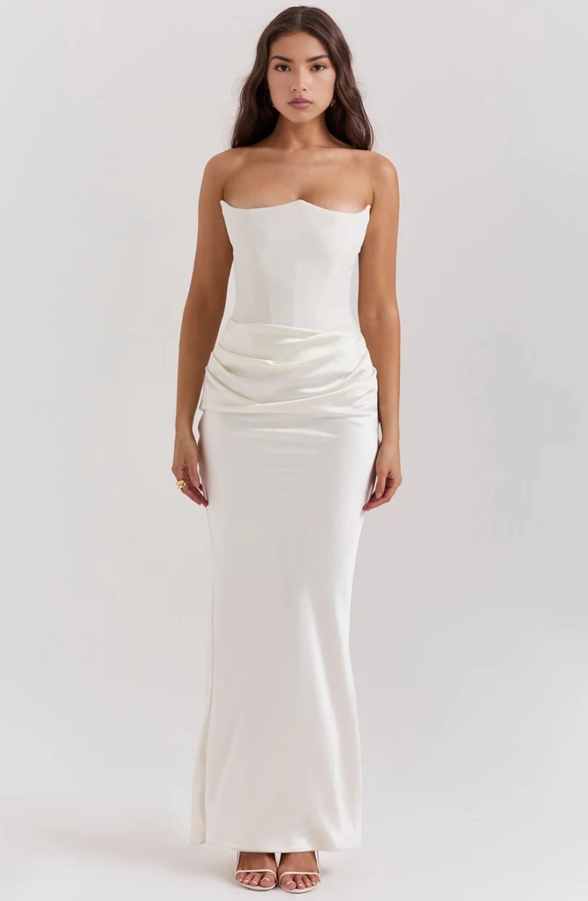 Strapless lace evening dress with flowing skirt, structured bodice.